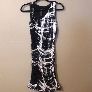 Form-fitting white and black dress
